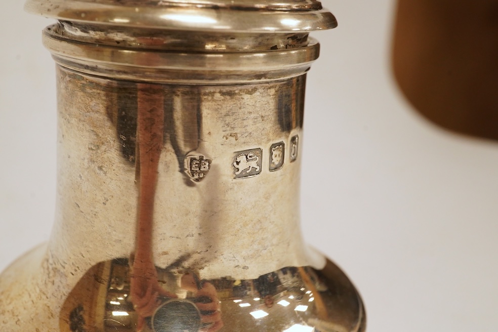 An Elizabeth II silver sugar caster, by Edward Barnard & Sons Ltd, London, 1959, 16.4cm, together with a silver napkin ring. Condition - fair